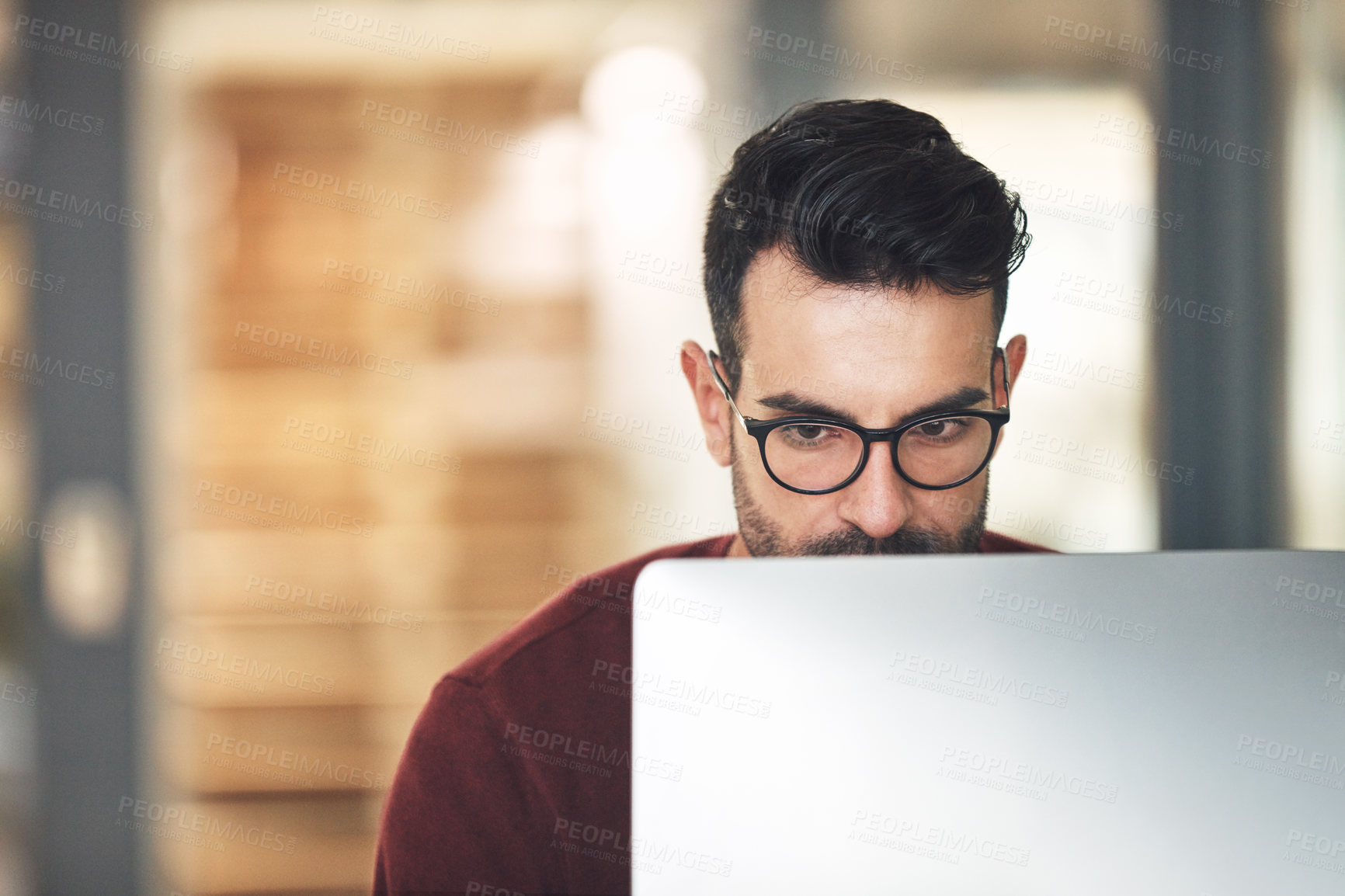 Buy stock photo Shot of a young businessman in the office