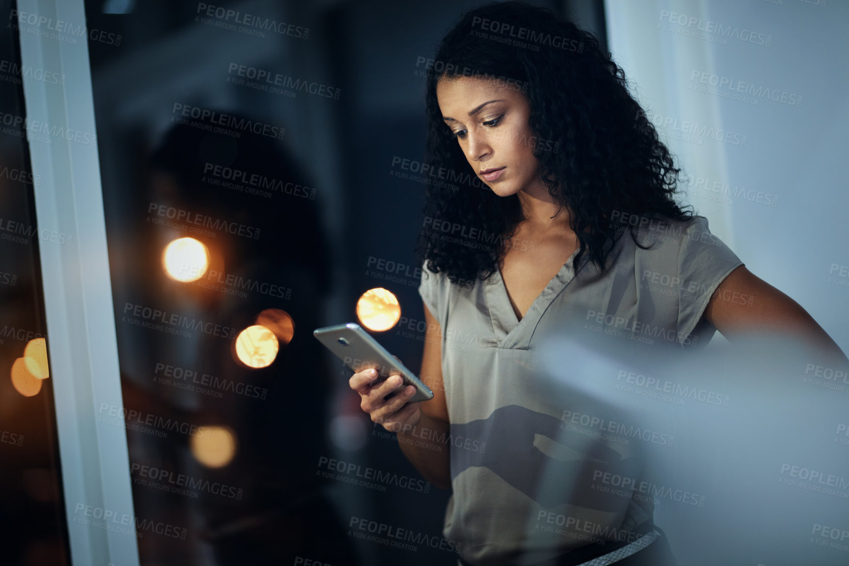 Buy stock photo Business, night and woman with cellphone, typing and internet with connection, social media and evening. Female person, employee or consultant with smartphone, contact and scrolling for text message