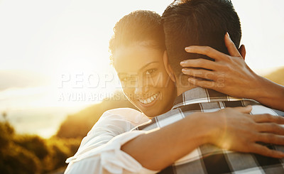 Buy stock photo Cropped shot of a loving couple  spending the day on the beach