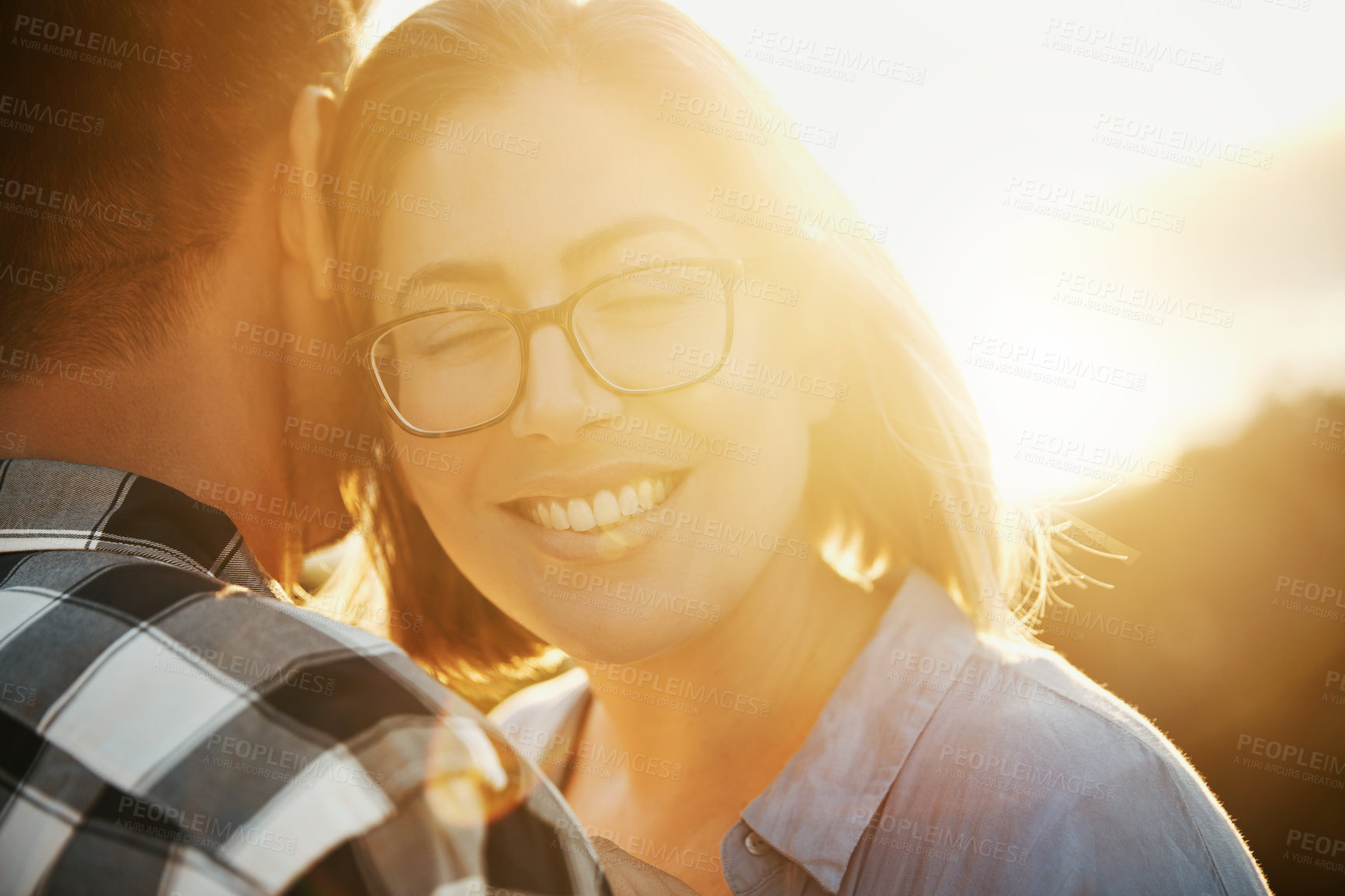 Buy stock photo Cropped shot of a loving couple  spending the day on the beach