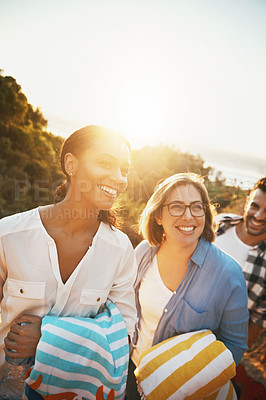 Buy stock photo Cropped shot of three friends enjoying themselves while spending the day outdoors