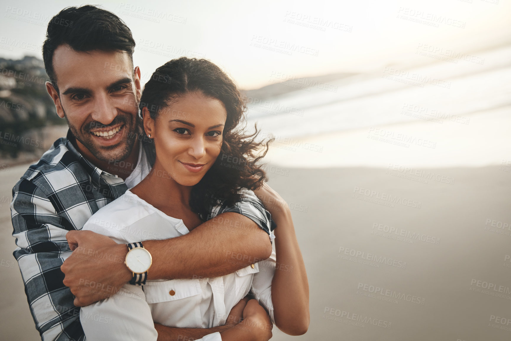 Buy stock photo Couple, hug and sunset at beach in portrait with care, love or connection for holiday by mock up space. Man, woman and embrace on vacation, date or outdoor in nature by sea, ocean and smile in Brazil