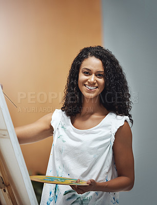 Buy stock photo Portrait of an attractive young woman painting on a canvas at home