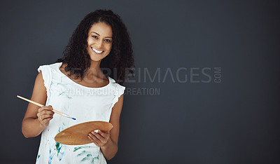 Buy stock photo Portrait of an attractive young female painter in the studio