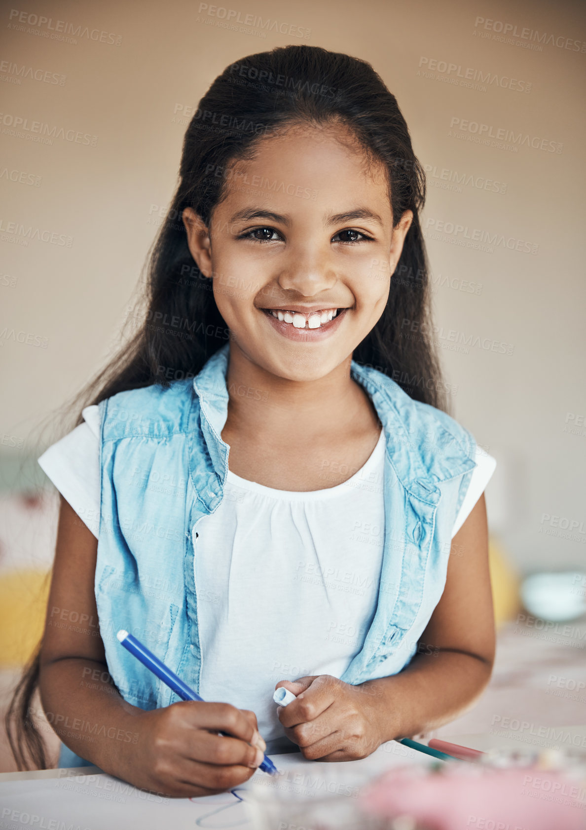 Buy stock photo Shot of a cute young girl drawing on paper at home