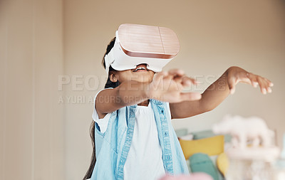 Buy stock photo Shot of a young girl using a virtual reality headset at home