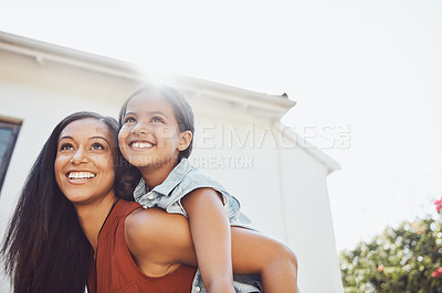 Buy stock photo Love, piggyback and happy mother playing with her child in the garden of the backyard of their home. Happiness, smile and young woman or mom having fun with her girl kid outdoor of their family house
