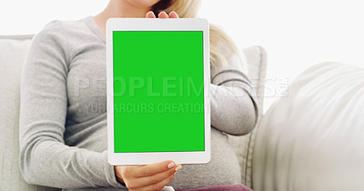 Buy stock photo Shot of an unrecognizable pregnant woman holding up a tablet at home