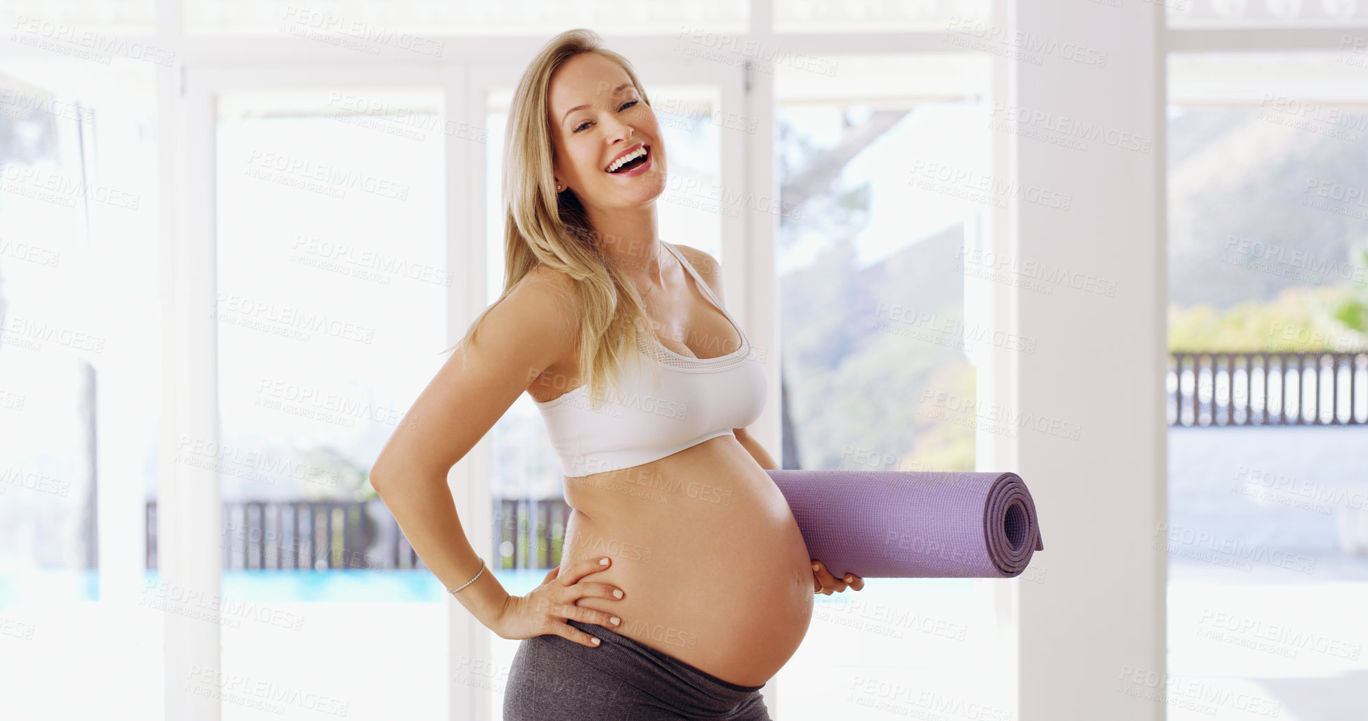 Buy stock photo Cropped portrait of an attractive young pregnant woman carrying a yoga mat