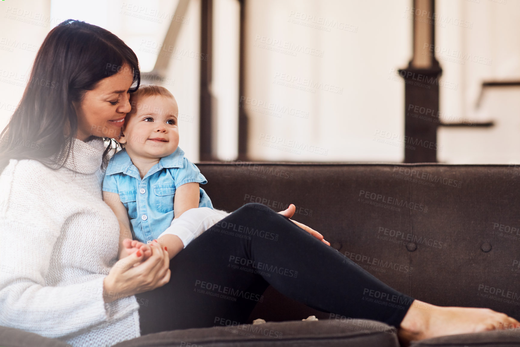 Buy stock photo Mom, baby and smile in sofa for bonding or support with love, growth and child development. Parent, toddler and happy at home with care, childhood memories and together with trust and joy on couch
