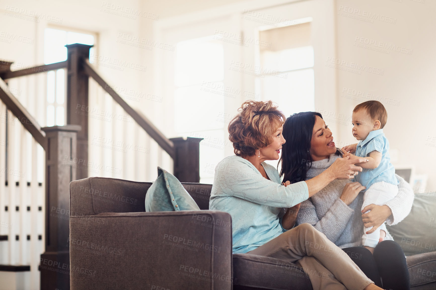 Buy stock photo Shot of an adorable baby girl bonding with her mother and grandmother at home