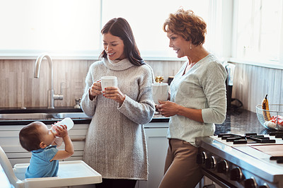 Buy stock photo Baby, grandmother and mom in kitchen for fun, support and coffee in family home. Women, talking and together in house for childcare, security and protection with toddler for visit or bonding