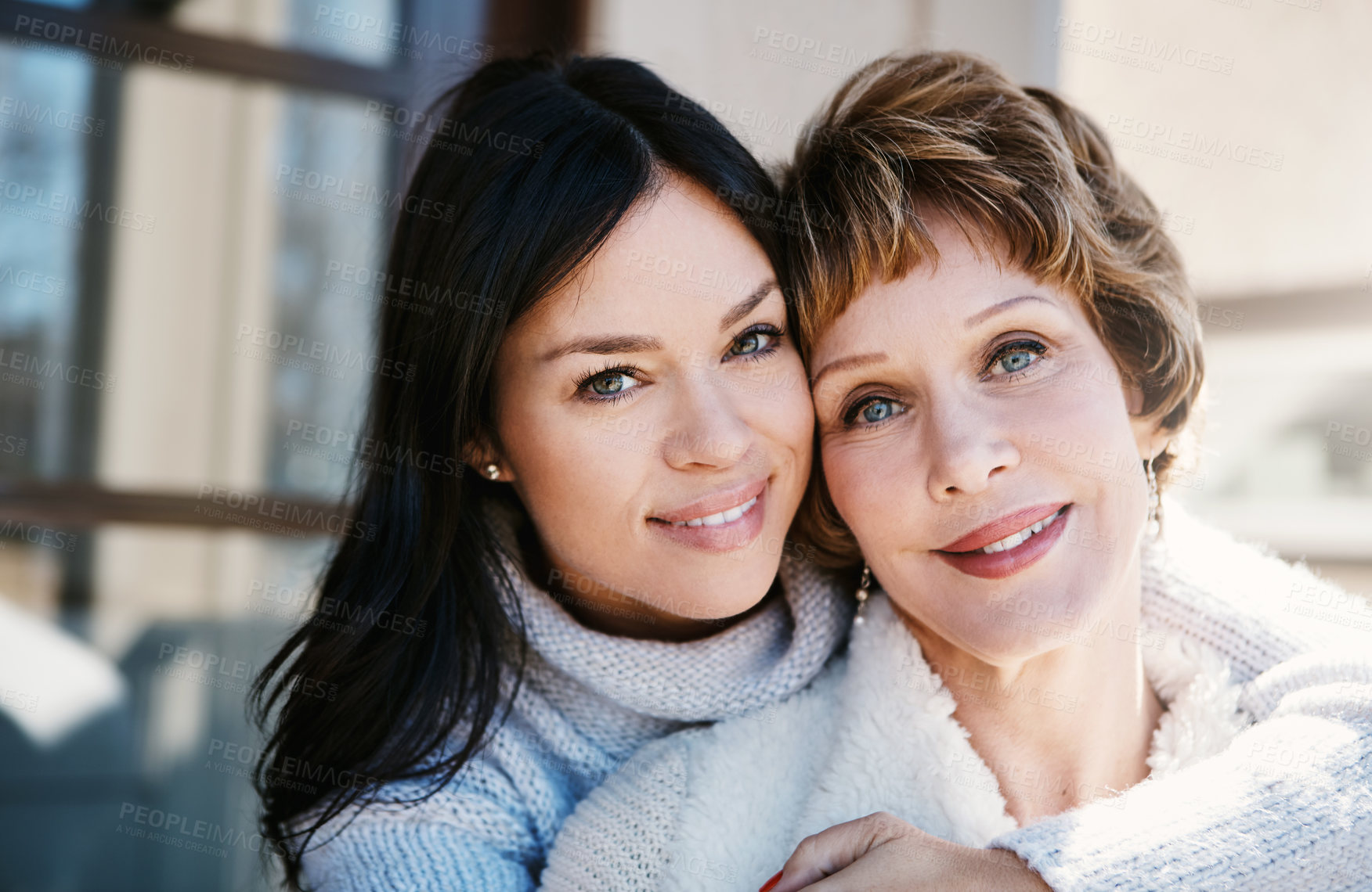 Buy stock photo Shot of a happy young woman spending quality time with her mother