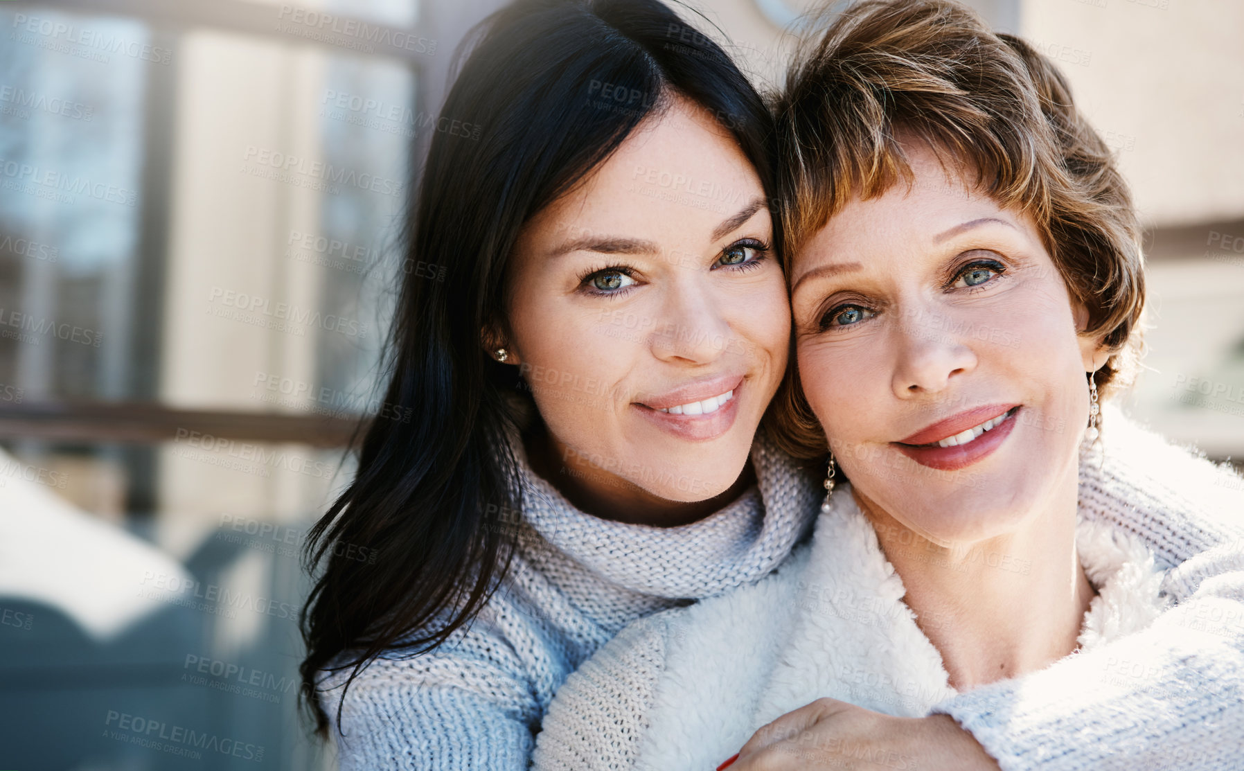 Buy stock photo Shot of a happy young woman spending quality time with her mother