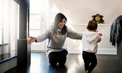 Buy stock photo Mom, baby and home with learning to walk for bonding or support with love, growth and child development. Parent, toddler and happy with care, childhood memories and together with trust and joy
