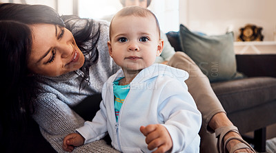 Buy stock photo Shot of an adorable baby girl bonding with her mother at home