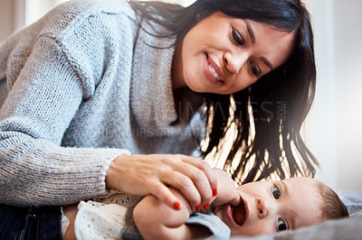 Buy stock photo Happy, love and mother with baby on a bed for playing, bonding and morning routine in their home together. Safety, family and woman with kid in a bedroom for learning, teaching or child development