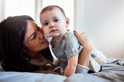 Buy stock photo Shot of an adorable baby girl bonding with her mother at home