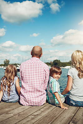 Buy stock photo Family, lake and pier on holiday portrait, peace and travel to relax by water together. Parents, children and love on vacation by river or care in nature, jetty and outdoor for relationship on trip