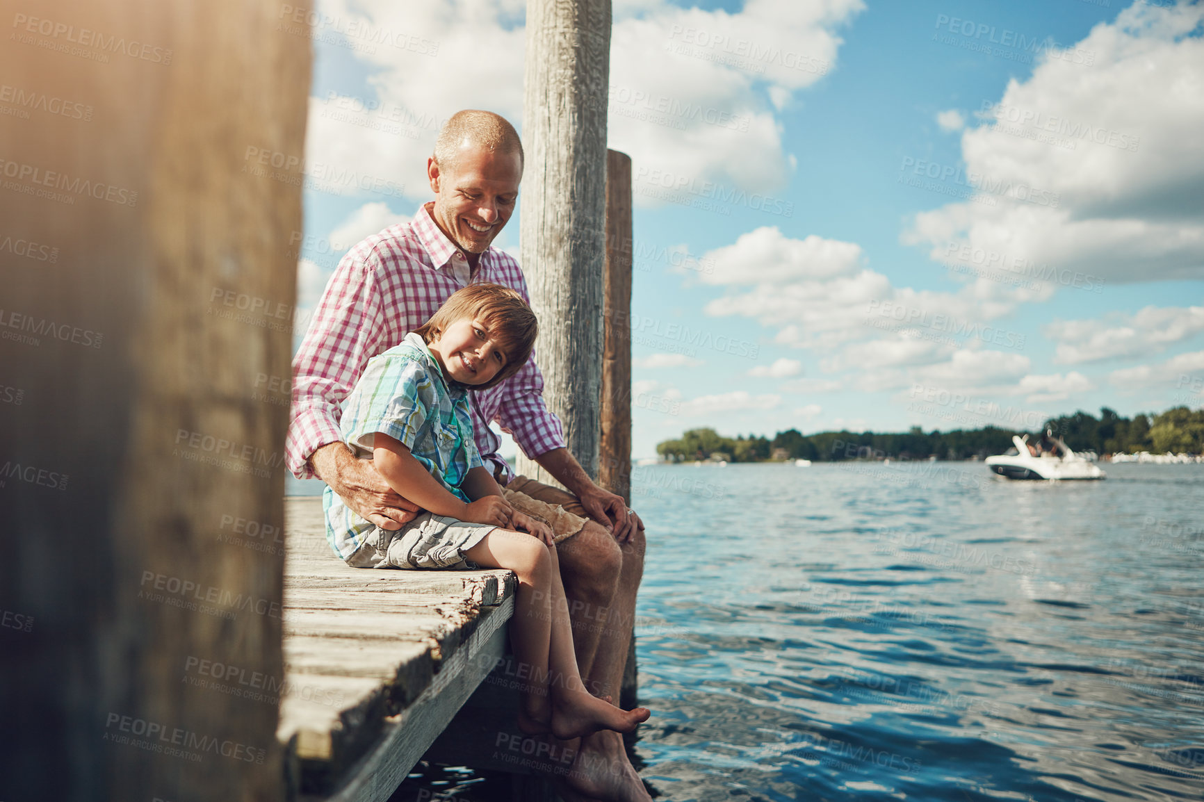 Buy stock photo Pier, portrait and father with child at lake for holiday, getaway or weekend trip with bonding. Happy, dock and dad with boy kid by river water for connection, care and family time on summer vacation