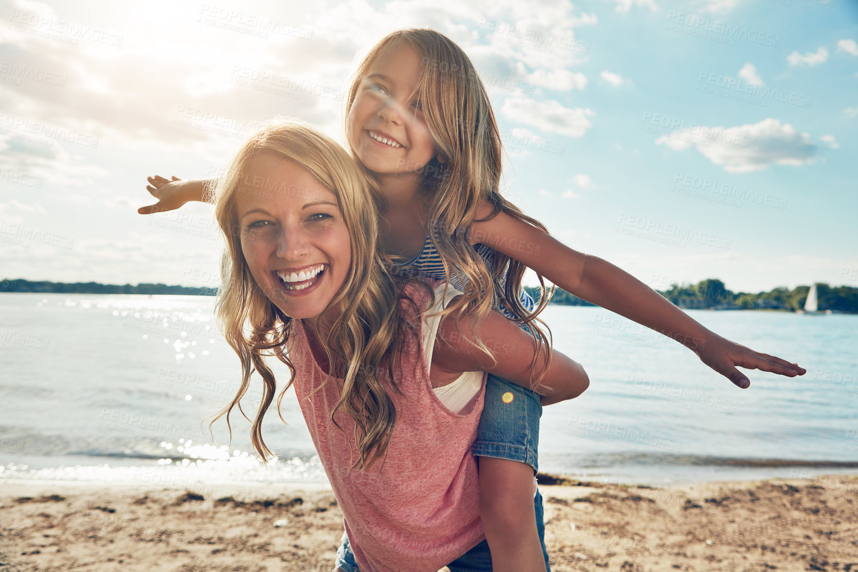 Buy stock photo Portrait, mom and girl on beach with piggyback, smile and playing on adventure holiday in Australia. Travel, mother and child on ocean vacation with summer fun, happy and bonding together with games.