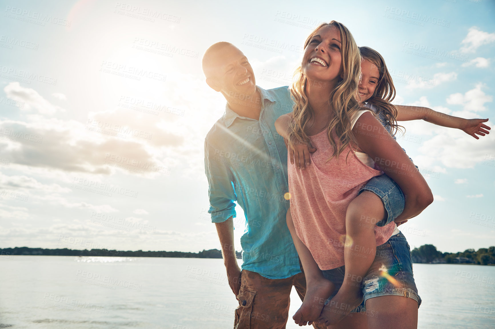 Buy stock photo Dad, mom and child on beach with piggyback, smile and playing on adventure holiday in Australia. Woman, man and girl on ocean vacation with summer fun, happy travel and bonding together with games