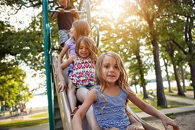 Buy stock photo Children, park slide and portrait of group in summer to relax with friends on playground on vacation. Happy, holiday and kids together for party, games or smile outdoor at school recess or break