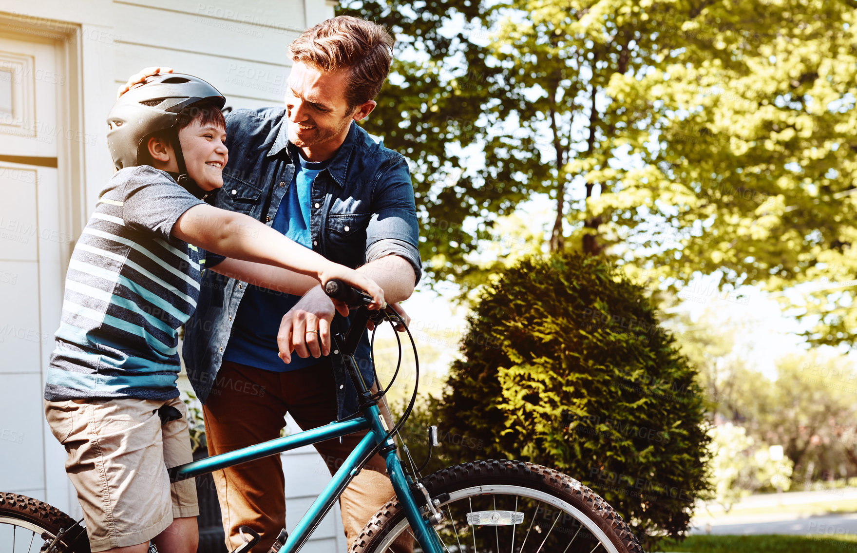 Buy stock photo Dad, boy and bicycle for teaching with laugh for guide, support or balance for safety in backyard. Happy people, father and child on bike in summer, learning and play for motivation in neighborhood