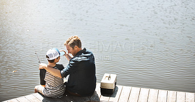 Buy stock photo Happy father, back and bonding with son or fishing rod by lake, ocean or beach together in nature. Dad with young child, kid or little boy with hug for lesson or tips to catch sea creatures by water