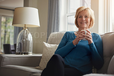 Buy stock photo Thinking, smile and senior woman on sofa with coffee, relax and nostalgic morning reflection at home. Remember, calm and elderly female person with tea break in living room for peace, memory or pride