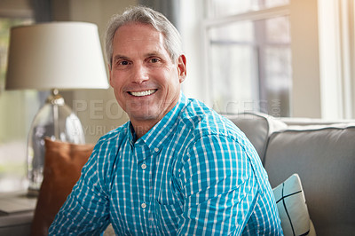 Buy stock photo Portrait of a happy mature man relaxing on the sofa at home