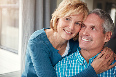 Buy stock photo Happy, smile and portrait of mature couple for bonding, loving relationship and relax together in home. Marriage, love and man and woman embrace for affection, commitment and romance in living room