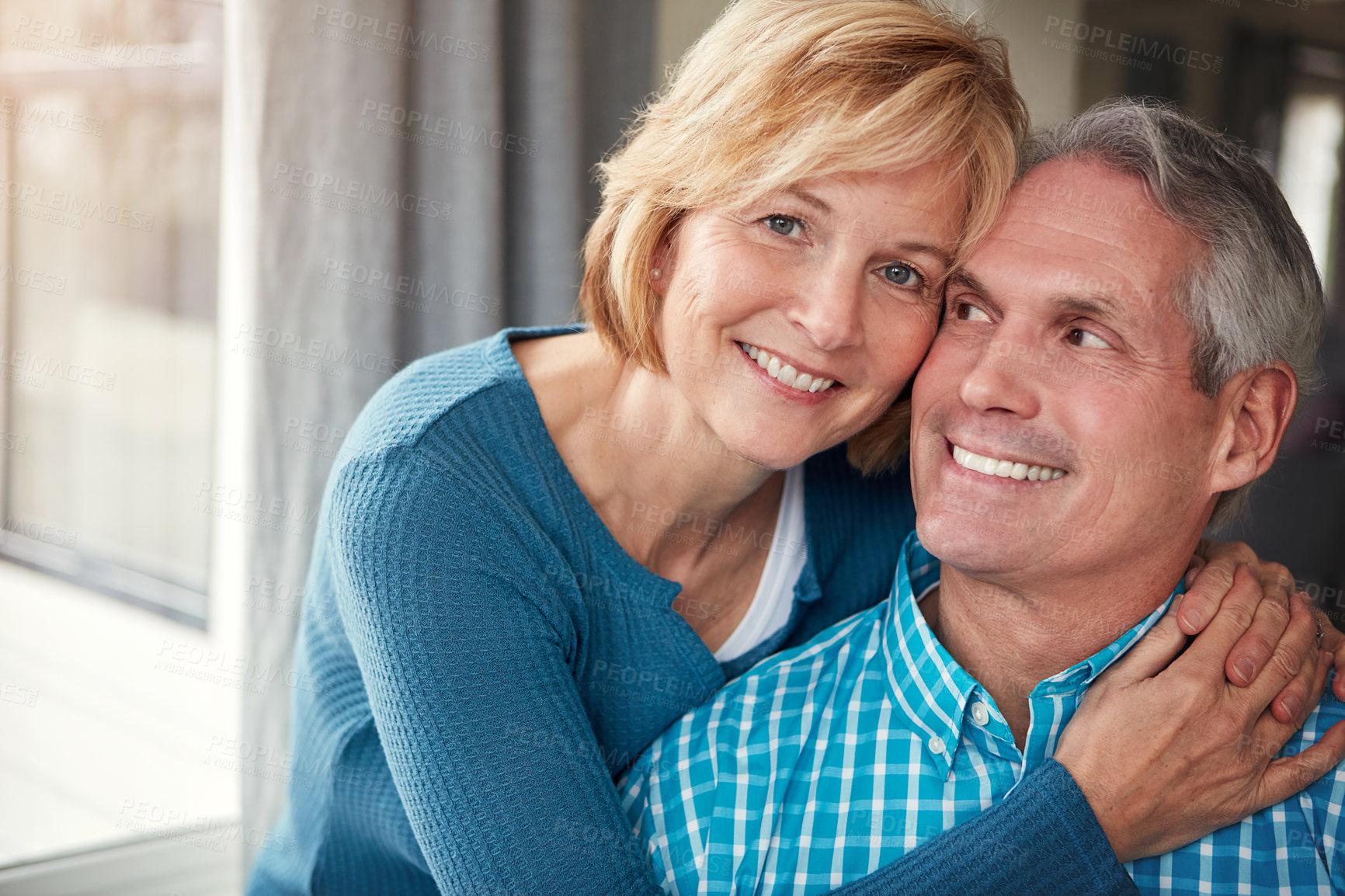 Buy stock photo Happy, smile and portrait of mature couple for bonding, loving relationship and relax together in home. Marriage, love and man and woman embrace for affection, commitment and romance in living room