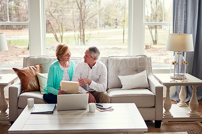 Buy stock photo Documents, computer and mature couple on sofa with financial report, insurance and investment in home. Retirement, marriage and senior man and woman on laptop for finance, pension or internet banking