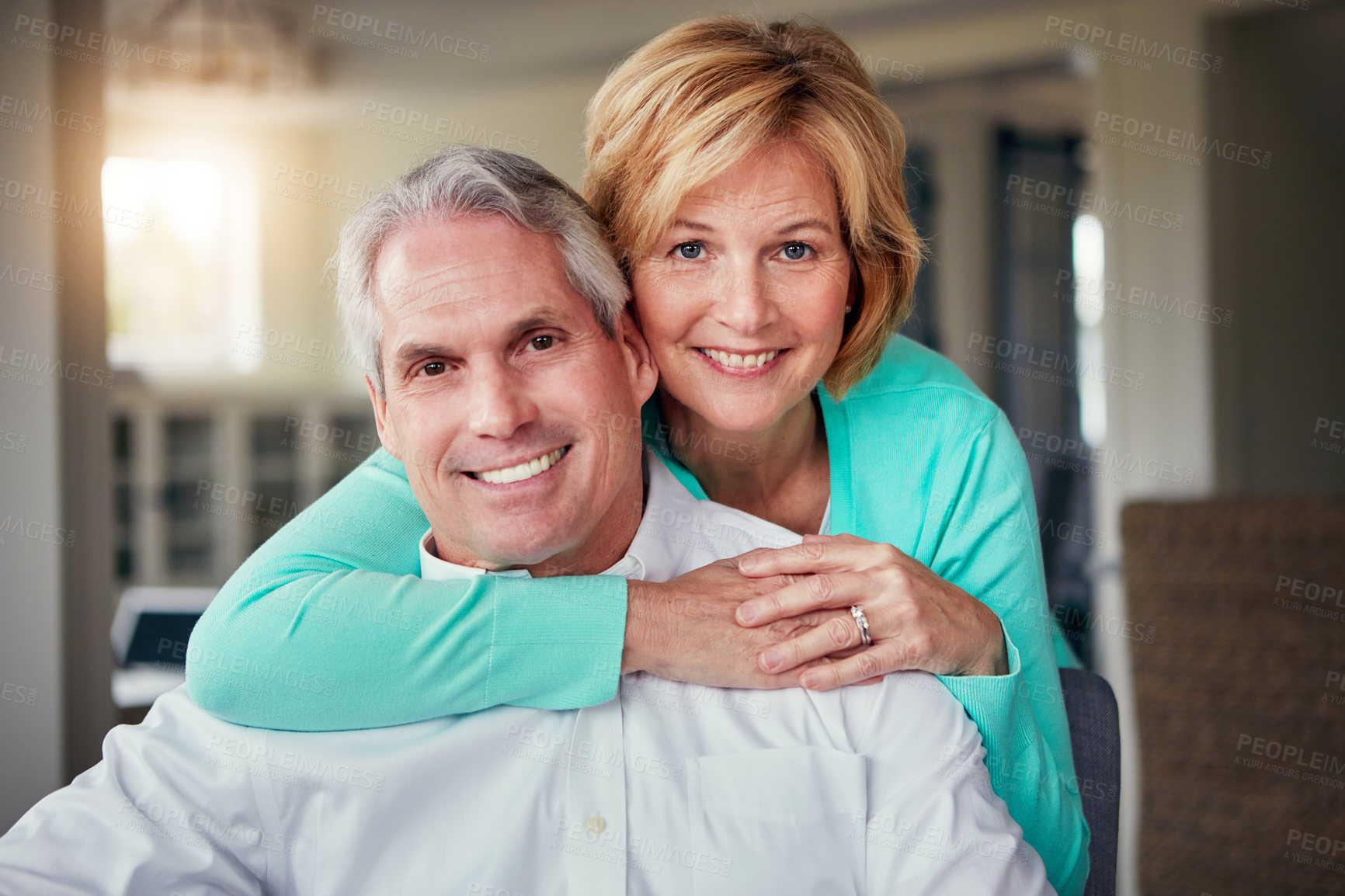 Buy stock photo Portrait of a mature couple relaxing together at home