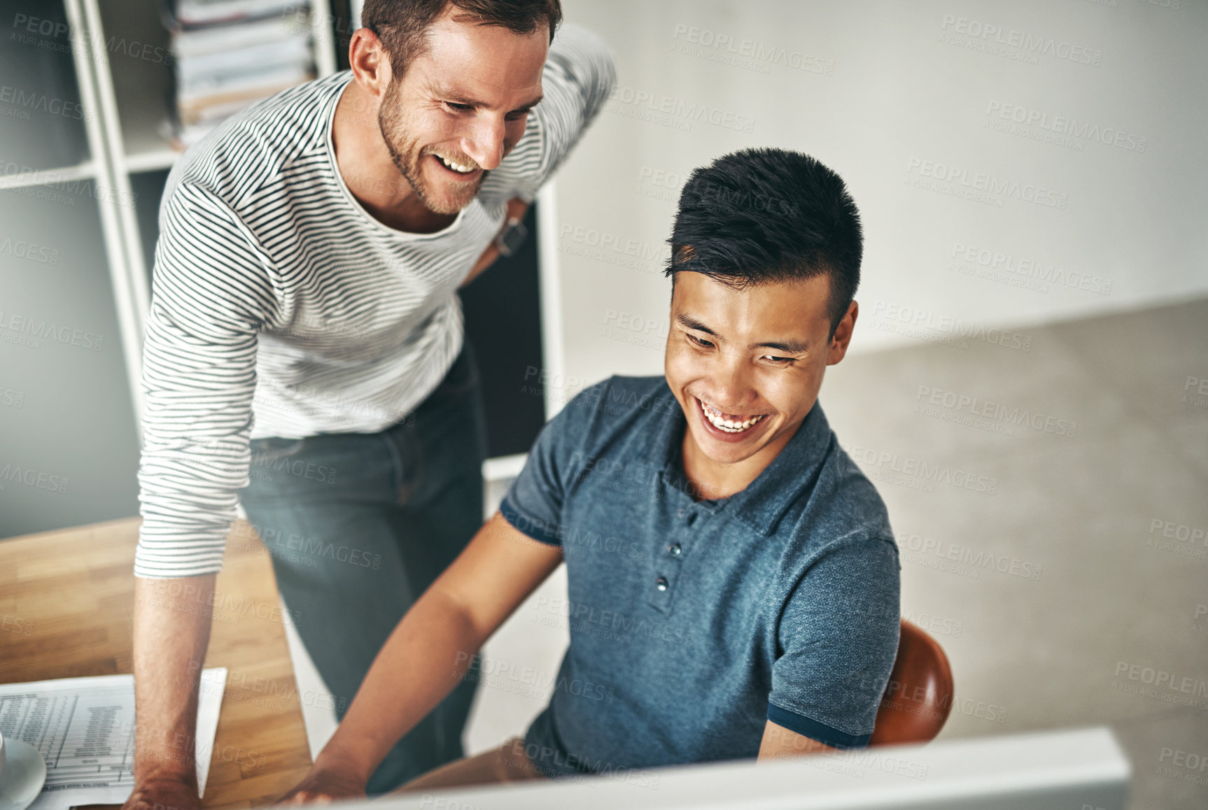 Buy stock photo Cropped shot of two designers working together on a project in an office