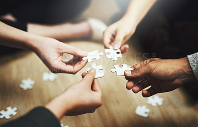 Buy stock photo Hands, business people and puzzle in circle, closeup and teamwork for problem solving, solution and game. Group, together and helping hand for jigsaw, solidarity and team building on office floor