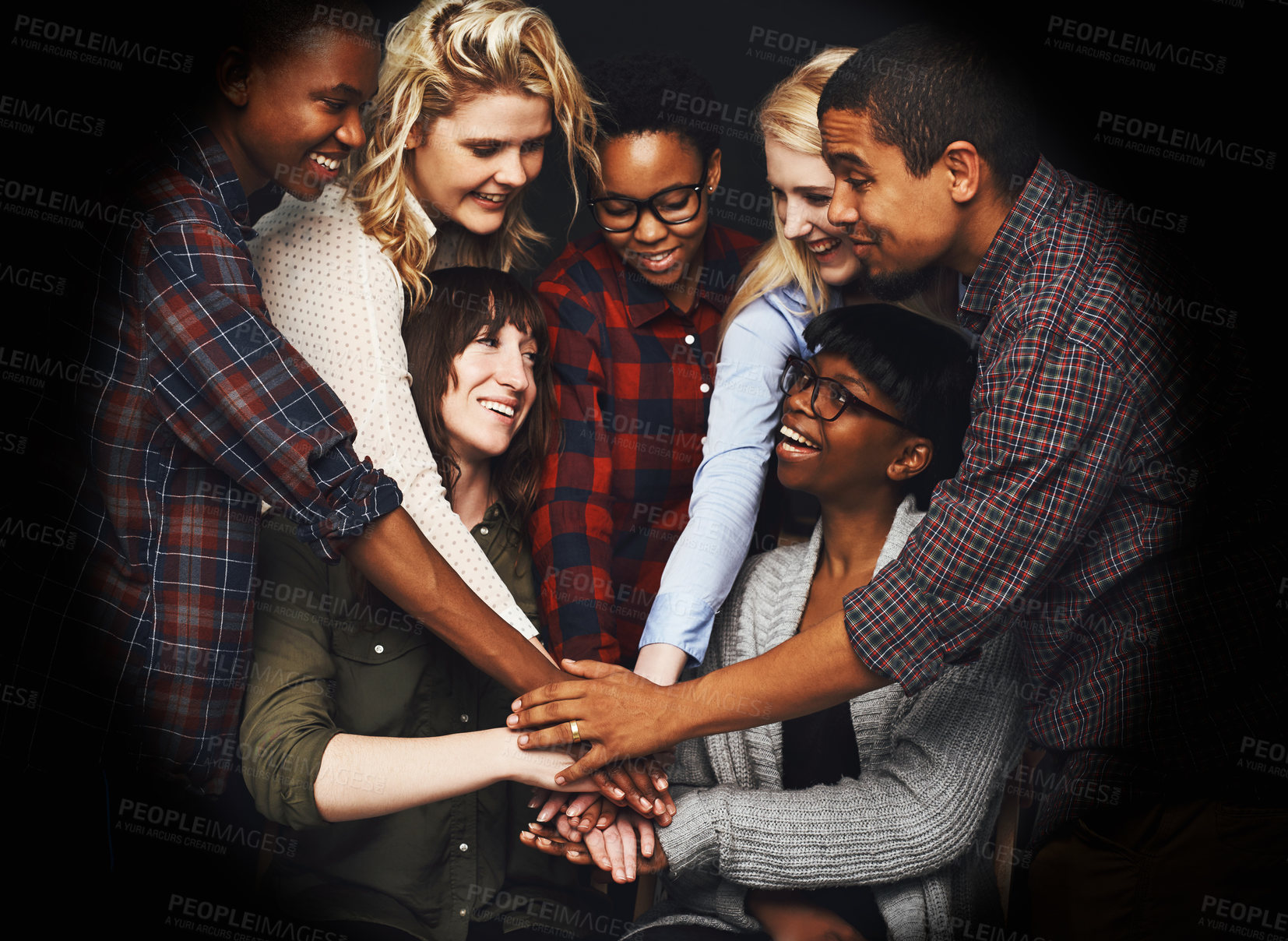 Buy stock photo Diversity, studio and happy with hands for synergy, celebration and deal on teamwork and collaboration. Dark background, people and smile for achievement with congratulations as partnership.
