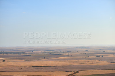 Buy stock photo Aerial view of dry brown farm land after harvest in Western Cape, South Africa. The sustainable ecological farming landscape during a drought season with a lack of rain for the grass and plants