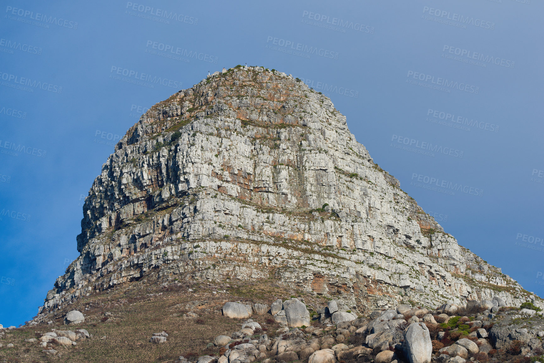 Buy stock photo Copy space with scenic view of Lions Head mountain in Cape Town South Africa against a clear blue sky background from below. Beautiful panoramic of an iconic landmark and famous travel destination