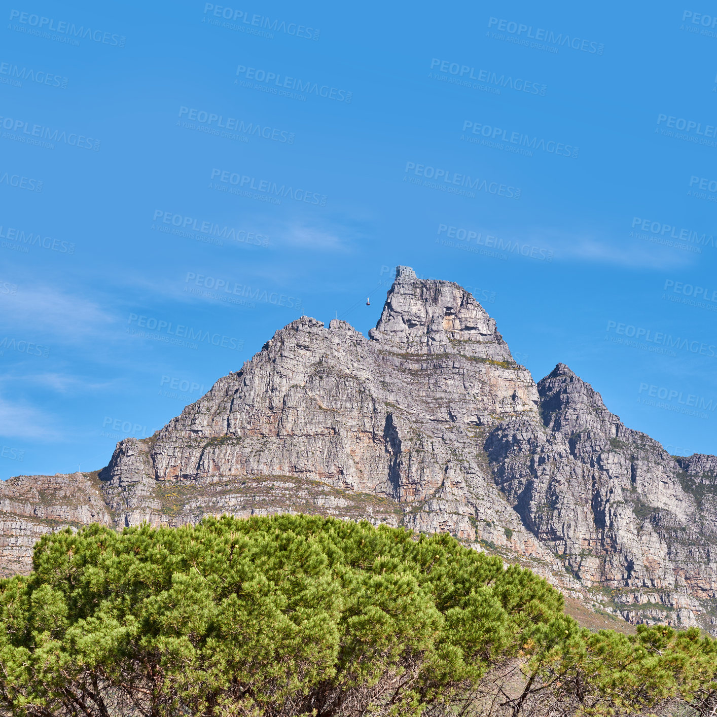 Buy stock photo Landscape view and blue sky with copy space of Table Mountain in Western Cape, South Africa. Steep scenic famous hiking and trekking terrain with trees growing around in. Cable car transport to peak