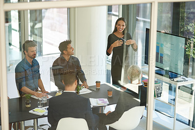 Buy stock photo Shot of a corporate businessperson giving a presentation in the boardroom