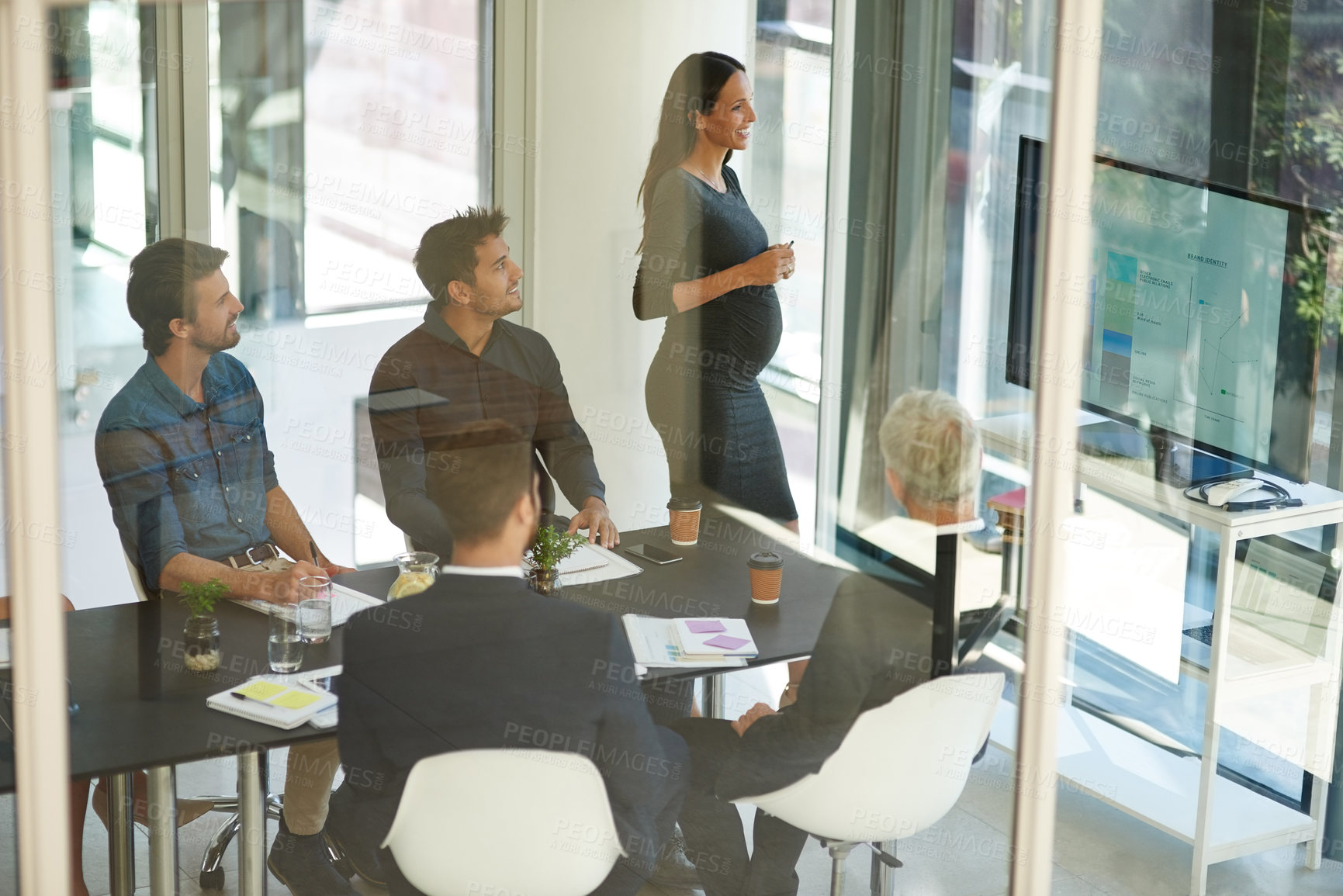 Buy stock photo Shot of a corporate businessperson giving a presentation in the boardroom