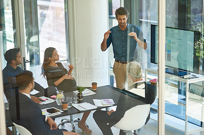 Buy stock photo Shot of a corporate businessperson giving a presentation in the boardroom