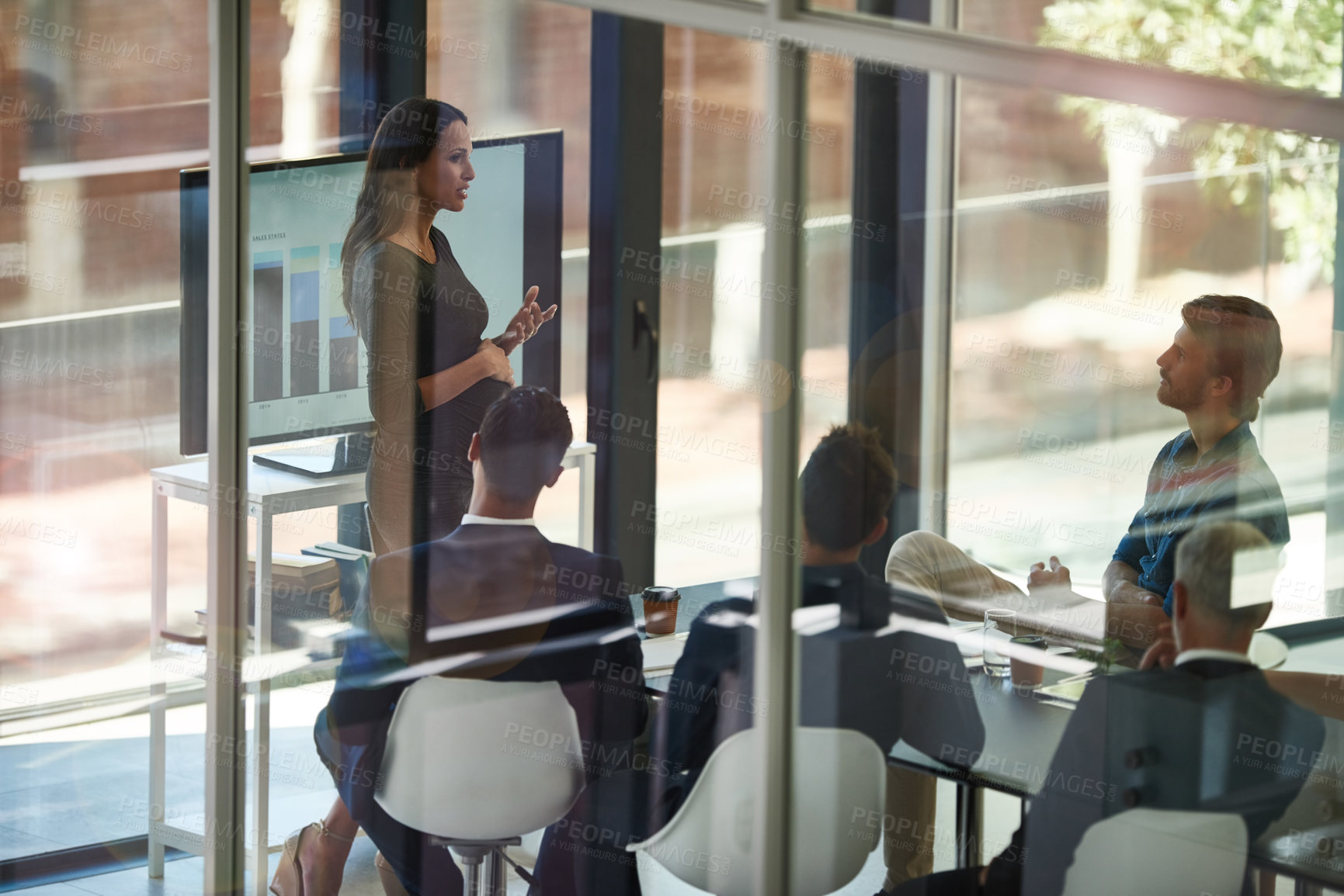 Buy stock photo Shot of a corporate businessperson giving a presentation in the boardroom