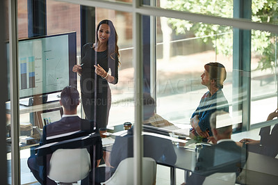 Buy stock photo Shot of a corporate businessperson giving a presentation in the boardroom