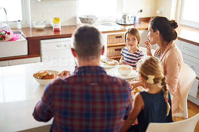 Buy stock photo Happy family, morning and eating breakfast on kitchen for meal or bonding time together at home. Mother, father and children with healthy food to start the day for nutrition or cereal in the house