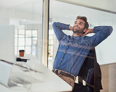 Buy stock photo Cropped shot of a handsome young businessman working in the office