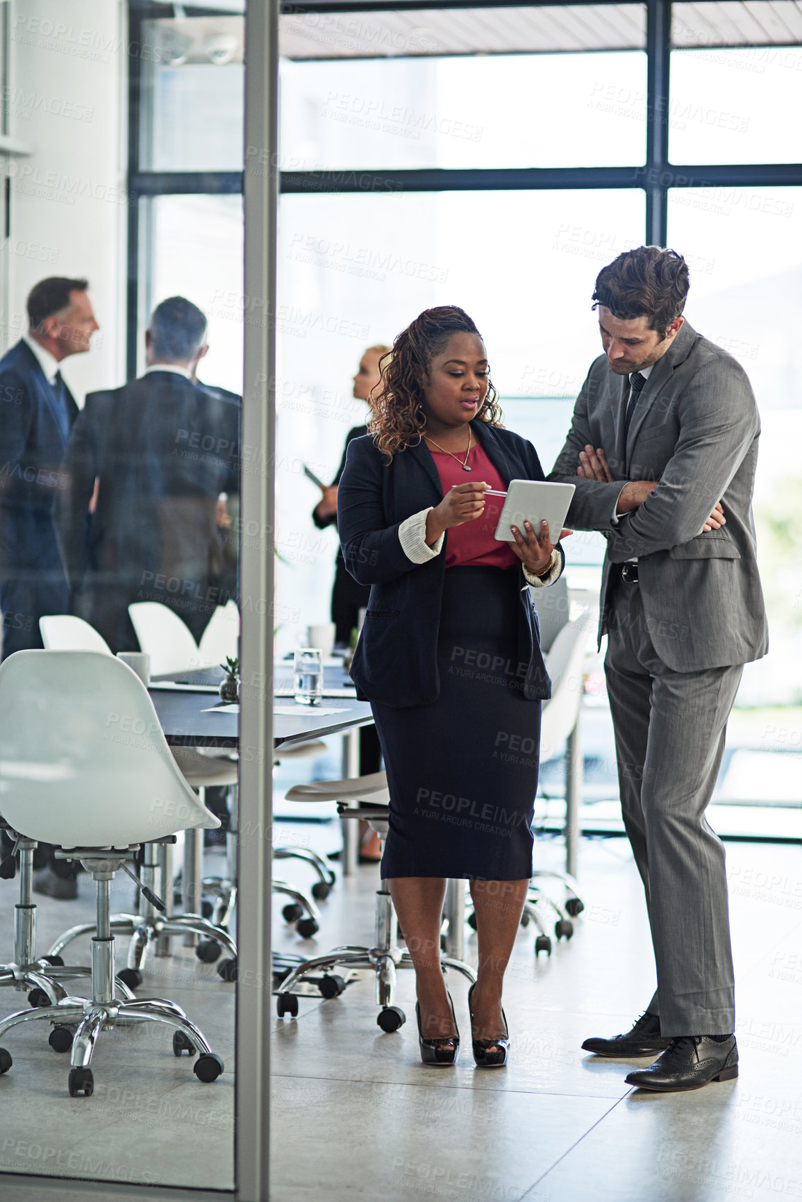 Buy stock photo Shot of corporate businesspeople meeting in the boardroom