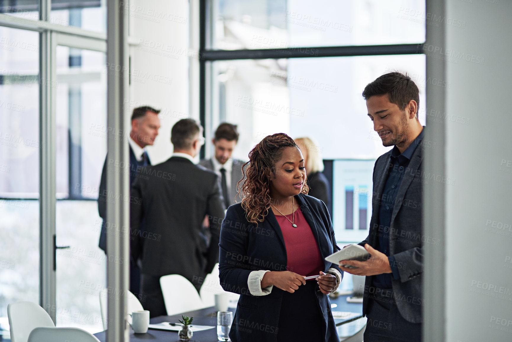 Buy stock photo Shot of corporate businesspeople meeting in the boardroom